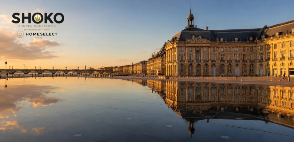 View of Bordeaux's Place de la Bourse reflected in the Miroir d'Eau with classic 18th-century stone facades lining the Garonne riverfront
