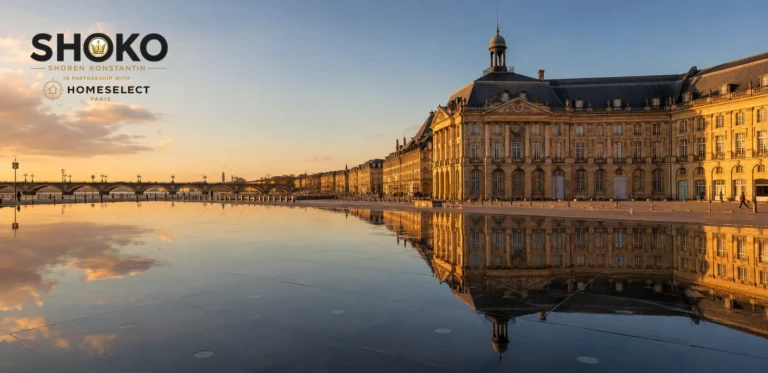 View of Bordeaux's Place de la Bourse reflected in the Miroir d'Eau with classic 18th-century stone facades lining the Garonne riverfront