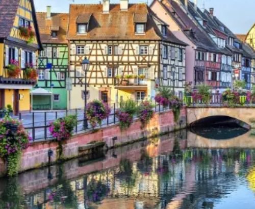 Historic architecture and lifestyle in Strasbourg with traditional Alsatian buildings, canals, and vibrant city life.